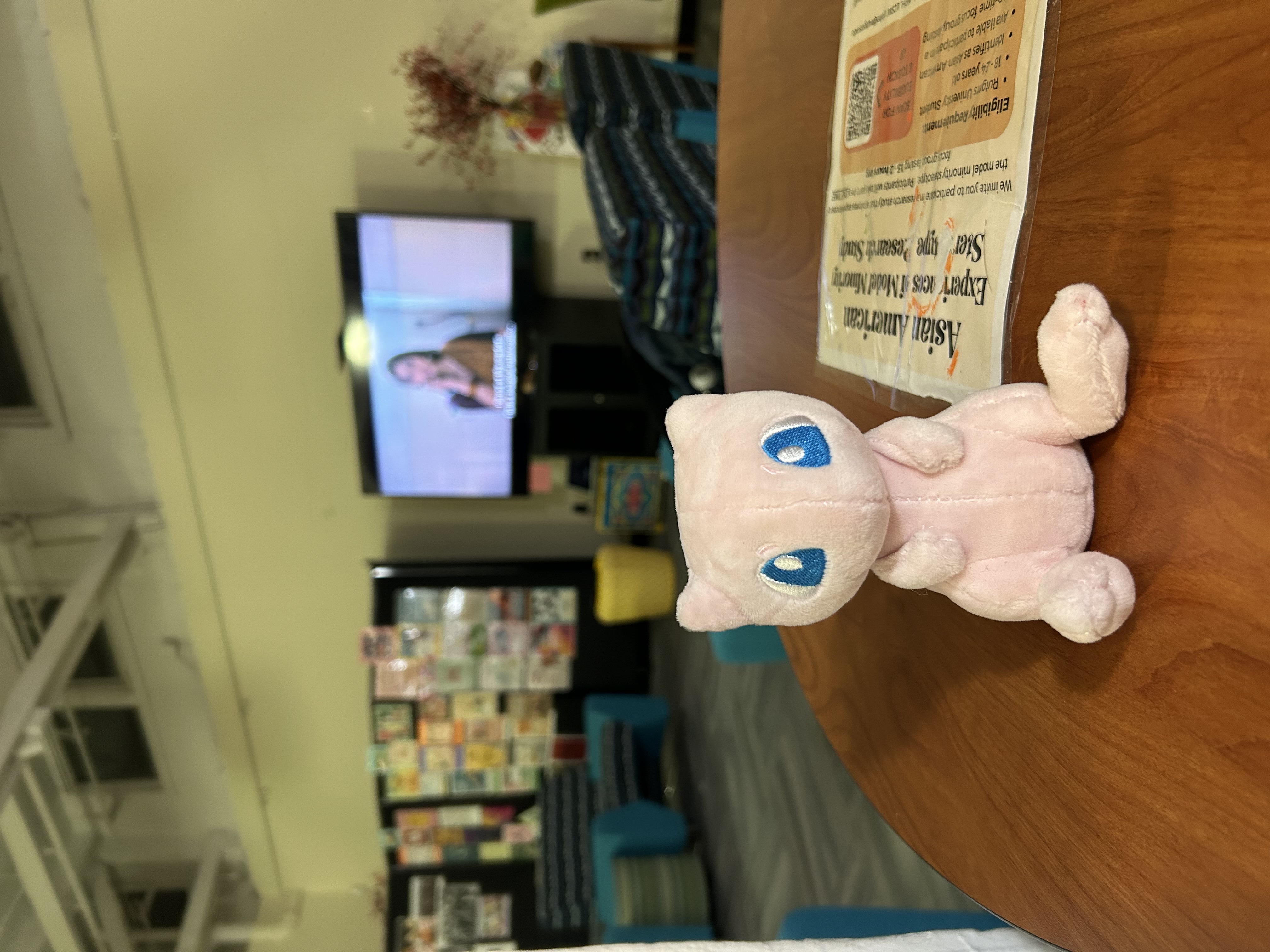 mew plushie on a table at the aacc